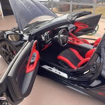 Red and black sports car interior cleaned and detailed