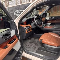 Freshly detailed tan and black vehicle interior