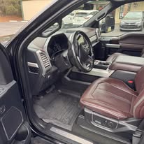 Brown leather truck front seats and dash after interior detailing