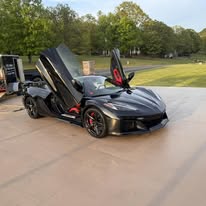 Black sports car shining after an exterior detail